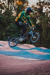 Preview wallpaper cyclist, stunt, jump, helmet, cycle track