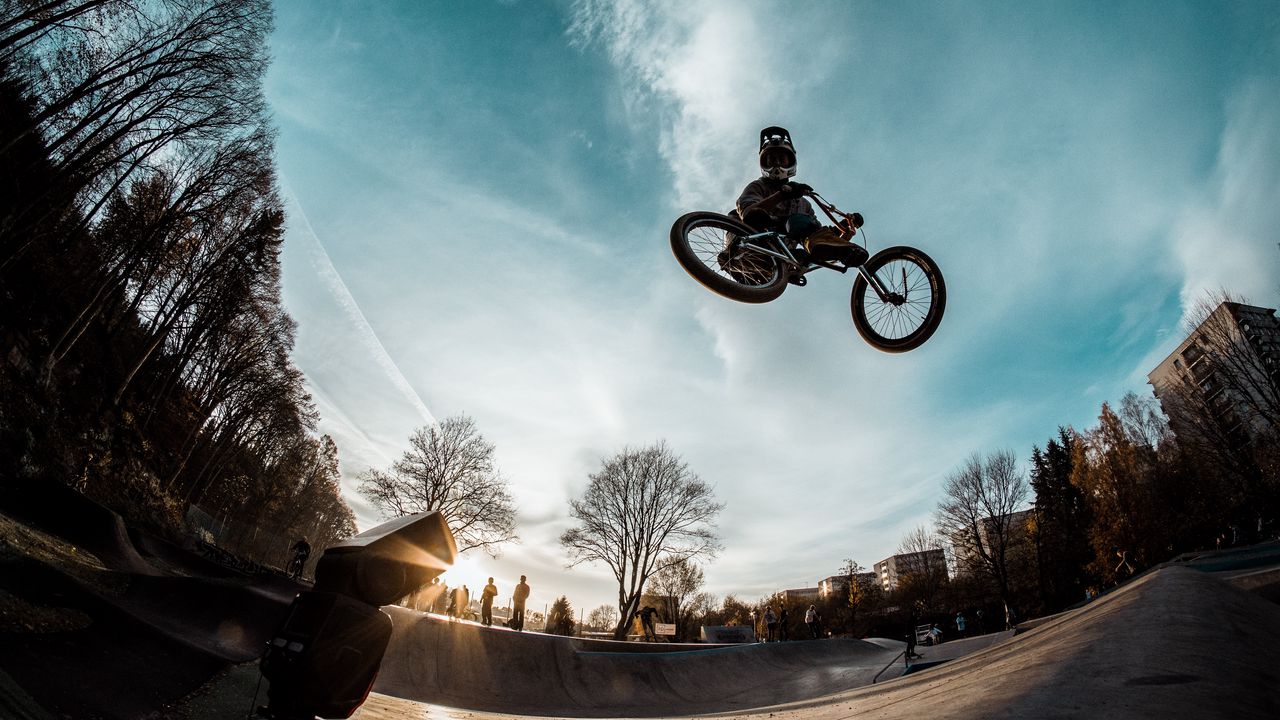 Wallpaper cyclist, trick, bicycle, helmet, sky