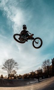 Preview wallpaper cyclist, trick, bicycle, helmet, sky