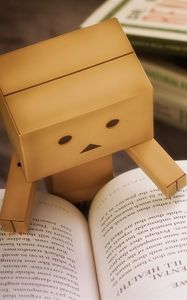 Preview wallpaper danbo, cardboard robot, book, reading