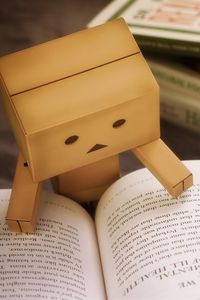 Preview wallpaper danbo, cardboard robot, book, reading