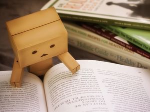 Preview wallpaper danbo, cardboard robot, book, reading