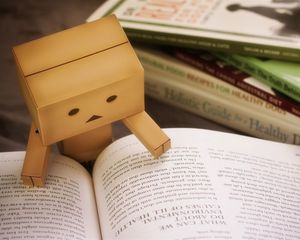 Preview wallpaper danbo, cardboard robot, book, reading