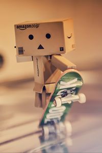 Preview wallpaper danbo, cardboard robot, skateboard, blur