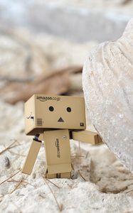 Preview wallpaper danboard, cardboard robot, sand, stone