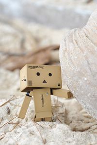 Preview wallpaper danboard, cardboard robot, sand, stone