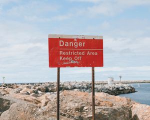 Preview wallpaper danger, sign, shore, stones