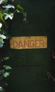 Preview wallpaper danger, words, inscription, plant