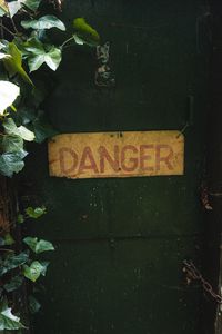 Preview wallpaper danger, words, inscription, plant