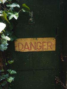 Preview wallpaper danger, words, inscription, plant