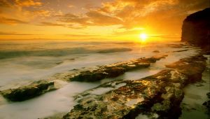 Preview wallpaper dawn, fog, stones, sea, sun, morning