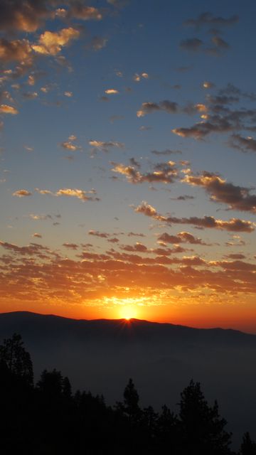 360x640 Wallpaper dawn, mountains, clouds, sun
