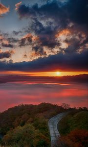 Preview wallpaper dawn, mountains, horizon, clouds, sunlight, road