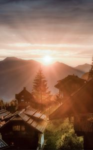 Preview wallpaper dawn, rays, village, buildings