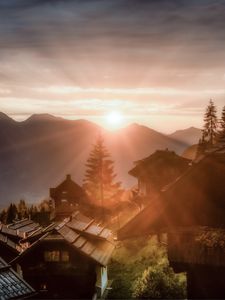 Preview wallpaper dawn, rays, village, buildings