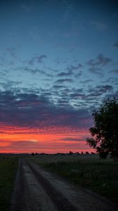 Preview wallpaper dawn, sunrise, horizon, road, clouds, morning, grass, sky