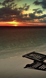 Preview wallpaper decline, beach, chair, shadow, sand, sun, sky