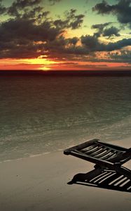 Preview wallpaper decline, beach, chair, shadow, sand, sun, sky