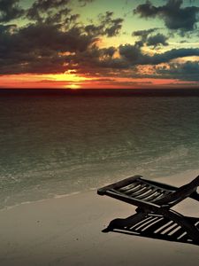 Preview wallpaper decline, beach, chair, shadow, sand, sun, sky