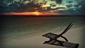 Preview wallpaper decline, beach, chair, shadow, sand, sun, sky