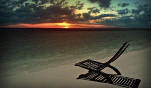 Preview wallpaper decline, beach, chair, shadow, sand, sun, sky