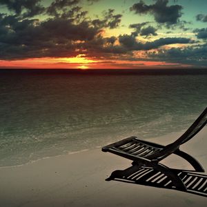 Preview wallpaper decline, beach, chair, shadow, sand, sun, sky