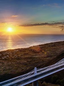 Preview wallpaper decline, coast, bridge, sky, ocean, horizon