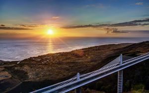 Preview wallpaper decline, coast, bridge, sky, ocean, horizon