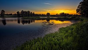 Preview wallpaper decline, lake, snags, branches, sky, orange, tranquillity