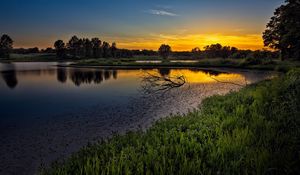 Preview wallpaper decline, lake, snags, branches, sky, orange, tranquillity