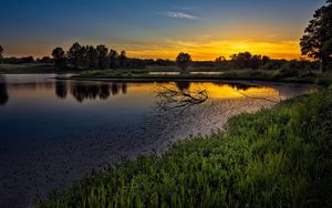 Preview wallpaper decline, lake, snags, branches, sky, orange, tranquillity