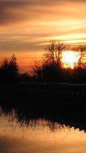 Preview wallpaper decline, orange, outlines, trees, bushes, reflection, sky