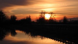 Preview wallpaper decline, orange, outlines, trees, bushes, reflection, sky