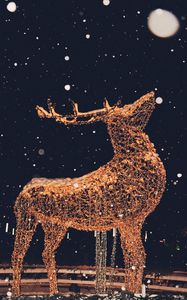 Preview wallpaper deer, sculpture, snow, garland, illumination, festive