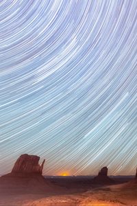 Preview wallpaper desert, cliffs, starry sky, blur, long exposure