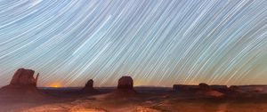 Preview wallpaper desert, cliffs, starry sky, blur, long exposure