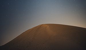 Preview wallpaper desert, hill, starry sky, night