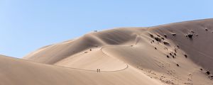 Preview wallpaper desert, hills, sand, silhouettes, travelers