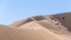 Preview wallpaper desert, hills, sand, silhouettes, travelers