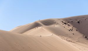 Preview wallpaper desert, hills, sand, silhouettes, travelers