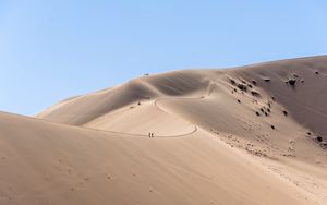 Preview wallpaper desert, hills, sand, silhouettes, travelers