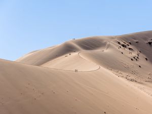 Preview wallpaper desert, hills, sand, silhouettes, travelers