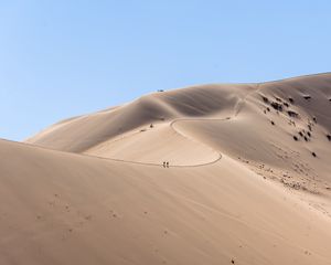 Preview wallpaper desert, hills, sand, silhouettes, travelers