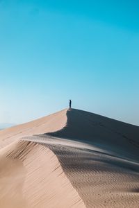 Preview wallpaper desert, man, alone, hill, sand