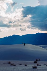 Preview wallpaper desert, people, hill, mountains, distance