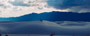 Preview wallpaper desert, people, hill, mountains, distance