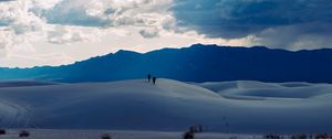 Preview wallpaper desert, people, hill, mountains, distance