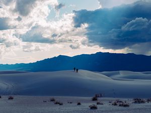 Preview wallpaper desert, people, hill, mountains, distance