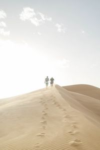 Preview wallpaper desert, people, sand, hills, walk