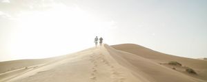 Preview wallpaper desert, people, sand, hills, walk